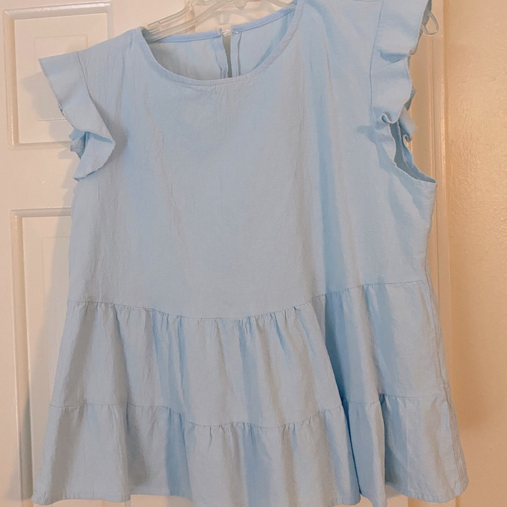 Cute blue top with ruffle sleeves